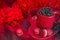 Red mug with macaroon rosted coffee beans sexy red background