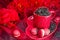 Red mug with macaroon rosted coffee beans sexy red background