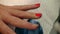 Red nail polish on female nails.