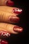 Red nail varnish nails