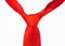 Red necktie knot close-up on white