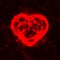 Red neon plasma laser heart on dark background