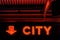 Red neon sign displaying the word `CITY`