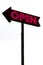 Red neon sign on rusty metal arrow on white background