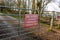 Red no access lifeboat emergency vehicle only sign on a gate in winter