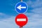 Red no entry road sign and blue direction arrow
