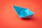 Red ocean business competition, survive success or winner company metaphor concept, blue origami paper ship on red background as