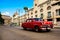 Red, old american classical car in road of old Havana Cuba