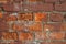 Red old brick textured wall