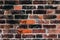 Red old clay brick wall damaged and weathered empty background texture