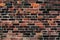 Red old clay brick wall damaged and weathered empty background texture large