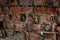 Red old crumbling weathered brick wall textured background