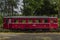 Red old historical diesel train with cargo green car in Ceska Kamenice town