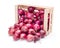 Red onion bulbs in wooden crate