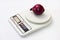 Red onion on a digital white kitchen scale