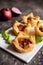 Red onion and sun-dried tomato mini tartlets