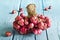 Red onions group on blue wooden background, soft focus