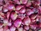 Red onions in plenty on display at local farmer`s market.