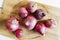 Red onions on the wood table