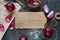 Red onions on the wooden table