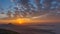 Red, oragne and blue dynamic sunrise with fog laying in valley