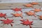 Red and Orange Autumn Leaves Paper Origami Background on the wooden table