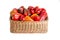 Red and orange bell peppers in a wicker basket on a white background, isolate. Autumn harvest of bell pepper, close-up