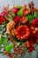 Red and orange bouquet with roses, gerberas, carnations and freesias