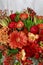 Red and orange bouquet with roses, gerberas, carnations and freesias