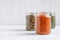 Red or orange lentils in a glass storage jar