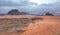 Red orange Mars like landscape in Jordan Wadi Rum desert, mountains background, overcast morning. This location was used