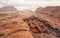 Red orange Mars like landscape in Jordan Wadi Rum desert, mountains background, overcast morning. This location was used as set