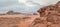 Red orange Mars like landscape in Jordan Wadi Rum desert, mountains background, overcast morning. This location was used as set