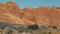 Red Orange Monolithic Rocks Formation In Dry Desert On Sunny Day In Motion