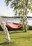 Red and orange striped hammock in sunshine