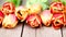 Red and orange tulip flowers in a row on wooden background in 4K VIDEO. Spring flowers.