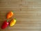 Red Orange and Yellow Peppers on Cutting Board