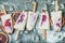 Red orange, yogurt, granola popsicles on ice cubes, concrete background