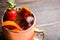 Red oranges and strawberry cocktail in copper mug variation of Moscow mule on the wooden background