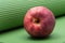 Red Organic Gala  Apple on Green Yoga Mat