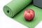 Red Organic Gala Apple and Yoga Block on Green Yoga Mat