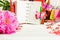 Red organizer with pink flower and colorful stationary over whit