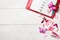 Red organizer and pink stationary on the wooden table