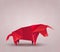 Red origami bull made of paper on Chinese background. The symbol of the Eastern New Year. Polygonal figure of livestock. Strong