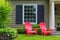 Red Outdoor patio Chairs on Front Yard green Lawn