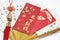 Red Packets and Trinket on Paper Fan