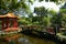 Red pagoda reflecting in a small pond at Jieshou Park across from the Presidental Office in Taip