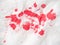 Red paint spots on white paper, close up view. Red inkblots on white background. Abstract picture. Colourful abstract