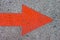 Red Painted Arrow on Concrete