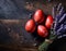 Red painted Easter eggs with lavender on dark rustic background